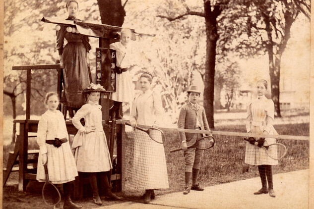 Children on a tennis court, circa 1890